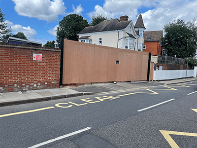 6 metre site gates with black timber cladding